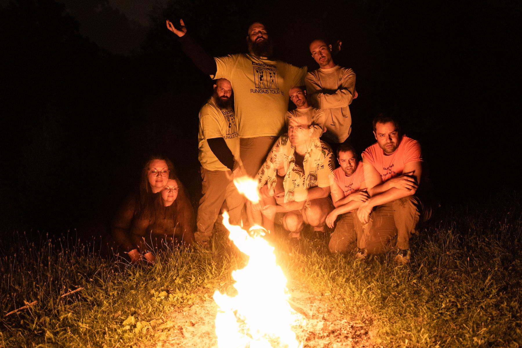 The band in front of a fire